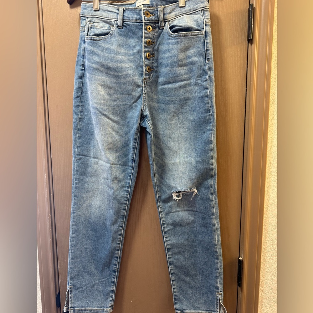 Sneak Peek High Rise Distressed Blue Jeans